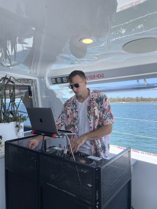 Alex Grey DJing a private boat event