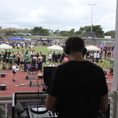 Alex Grey DJing a sporting event